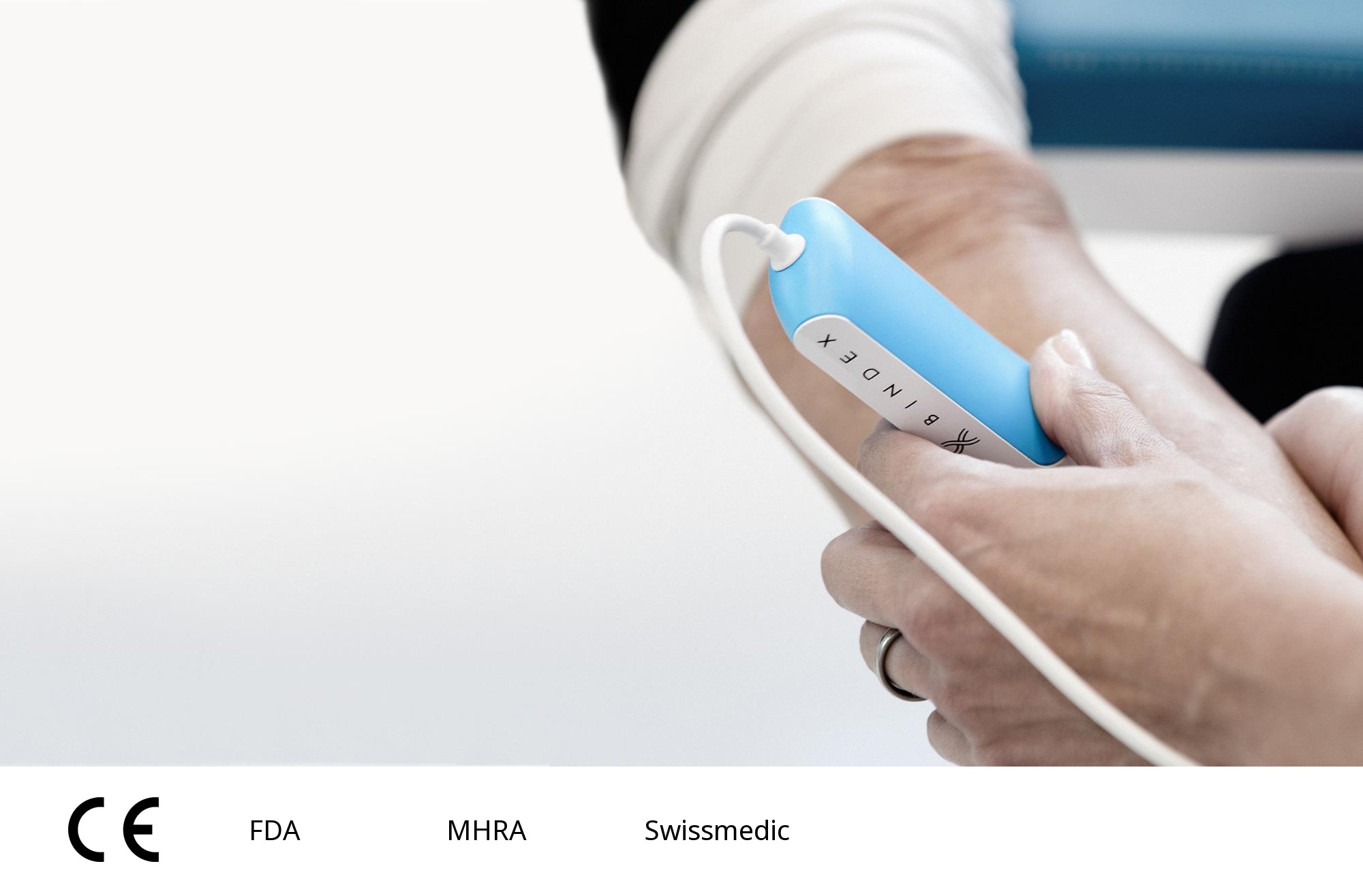 Bindex ultrasound probe during a patient measurement, with CE mark and FDA, MHRA and Swissmedic labels from the supplied training presentation